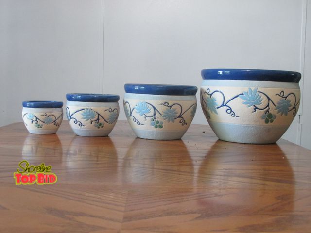 Lot 59-10080 - 4 piece matching design planter set.  Biggest planter has a 10" opening across the top, smallest has...