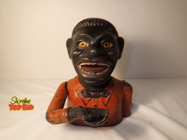 Lot 59-20052 - Original Antique Cast Iron Late 19th Century Jolly Black Man Mechanical Bank. This is a historical B...