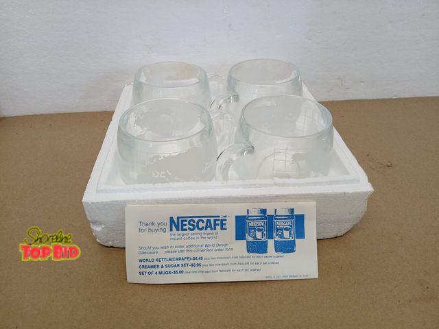 Lot 59-71034 - Set of 4 The Nestle Co. Inc. Frosted World Globe Cocoa Coffee Tea Mug Glasses