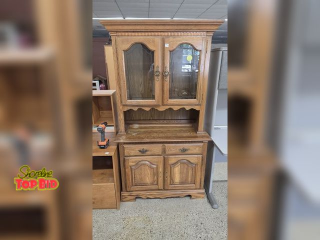Lot 59-95006 - OFFSITE  China Cabinet with lightbulb Missing handles on bottom doors Scuff marks 76 in tall  40 in ...