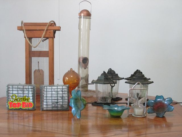 Lot 59-10082 - Mixed lot of various types of bird feeders: 4 regular seed feeders; 1 thistle feeder; 1 nectar feede...