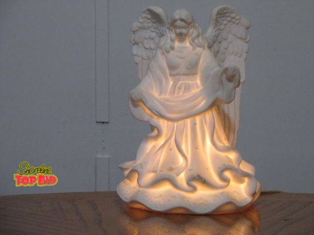 Lot 59-10114 - 9"T angel lamp, angel's body lights up when light switch is turned on, looks and works good