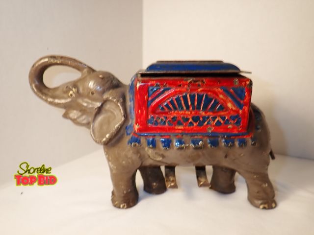 Lot 59-21003 - Classic Mechanical Cast Iron Elephant Cigarette Dispenser, circa 1920s. Est. Value $100 - $300, 5" t...