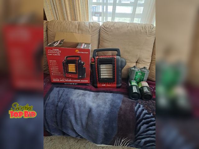 Lot 59-76026 - Buddy mr heater...4,000/9,000 but 4 propane tanks...new