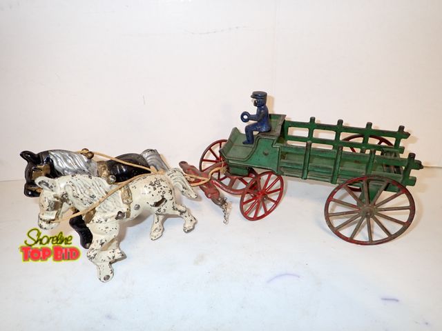 Lot 59-10310 - Ca. 1920 Rare Kenton Cast Iron Two-Horse Wagon 15" long. Estimated value $125.00 to $185.00