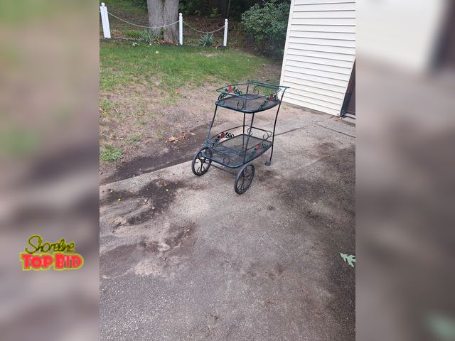 Lot 59-76058 - Off site...Outside metal cart used for holding plants..back wheels need replaced