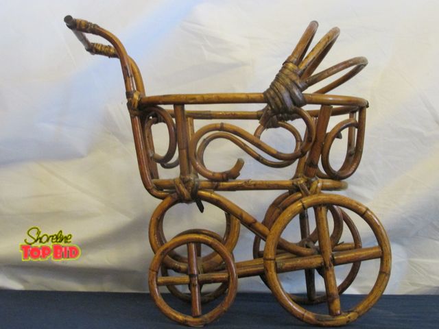Lot 59-10059 - Solid wood handmade miniature baby buggy.  The craftsmanship is excellent, is in perfect condition. ...