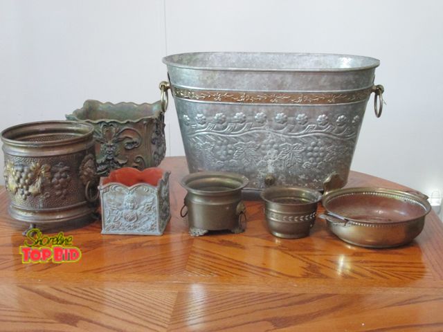 Lot 59-10081 - 7 piece group of ornate yard decor planters.  Most are metal, some have clawfoot legs, some have lio...