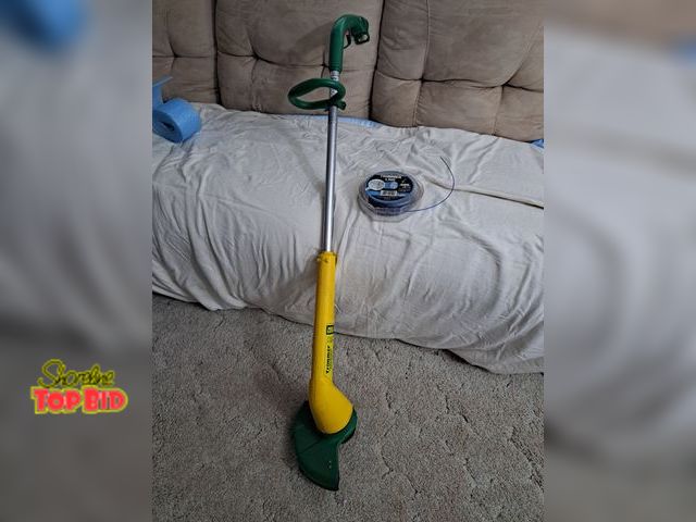 Lot 59-76067 - Weed trimmer n Xtra line...works