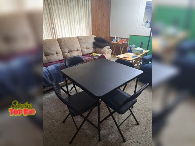 Lot 59-76055 - Black card table with 4 padded chairs..great condition