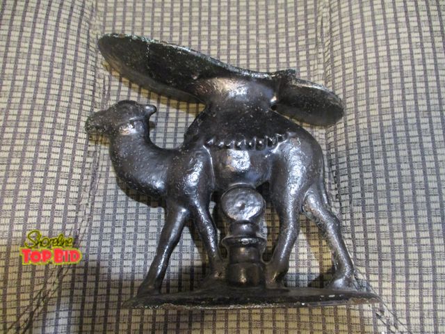 Lot 59-92038 - heavy iron camel shoeshine  stand