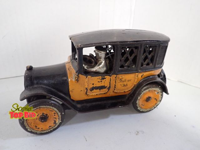 Lot 59-10328 - Antique Original Arcade Cast Iron Yellow Taxicab Bank with Driver