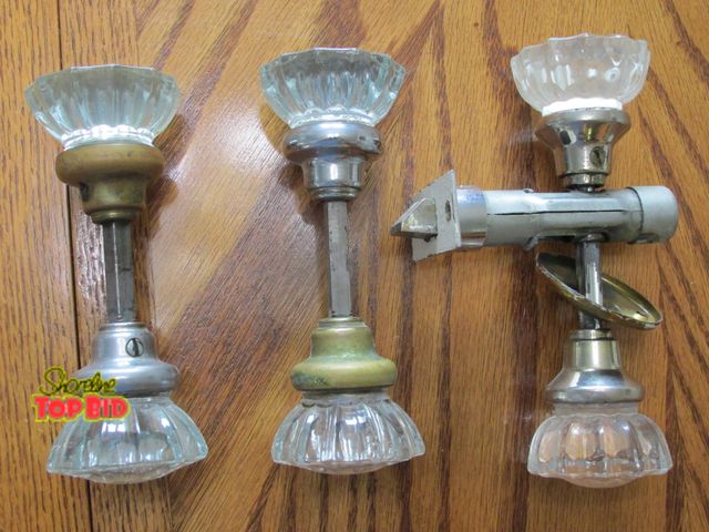 Lot 59-10110 - Three glass doorknobs, designed to give the appearance of intricately cut fine crystal.  When wed cl...