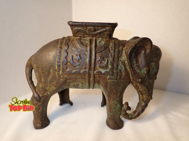 Lot 59-21270 - Antique Cast Iron Elephant with "Howdaw" Still Bank by A.C. Williams Co. circa 1905 and 1934. Est. V...