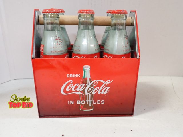 Lot 59-43595 - Six Pack Coca-Cola Classic Glass Bottles in a Commemorative Red Metal Carrier - Contents are NOT for...
