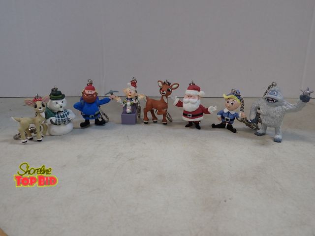 Lot 59-41645 - Collection of 8 keychains, character's based on the 1964 TV special Rudolph the red nose reindeer