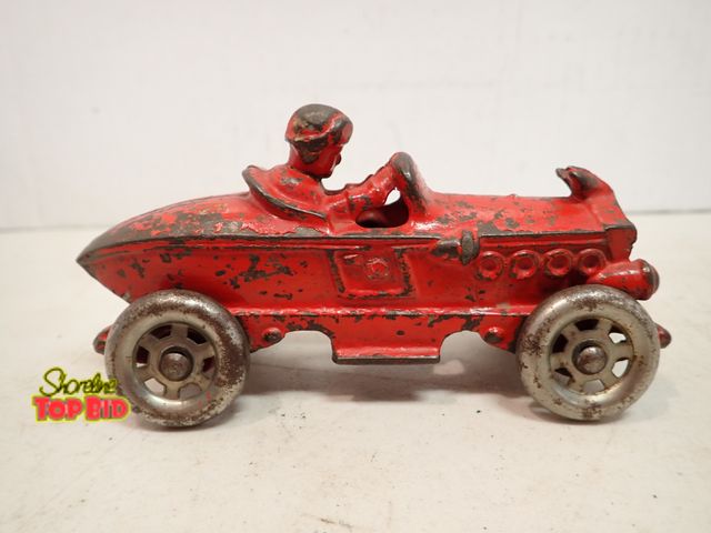Lot 59-14363 - Ca. 1920, Cast Iron Boat Tail Racer good condition, Toy by A.C. Williams. Estimated value $150.00 to...