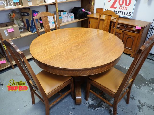 Lot 59-50121 - Beautiful Tiger Oak Antique Round Dining Room Table Set, Pedestal Style with 4 Chairs Featuring Ostr...