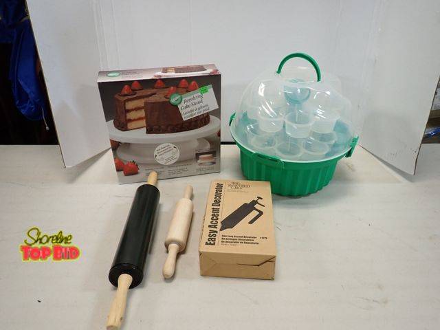 Lot 59-41607 - Cupcake Travel Storage, Revolving Cake Stand, Rolling Pins, and Accent Decorator