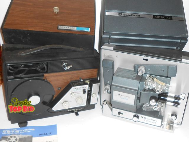 Lot 59-74230 - 2 Vintage Movie Projectors - both power up and appear to be fully functional.  1 - Keystone Dual 1- ...