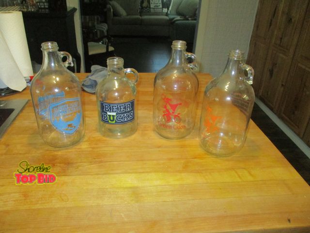 Lot 59-92044 - 1 4 beer money wine jugs, + 2- 1 gallon