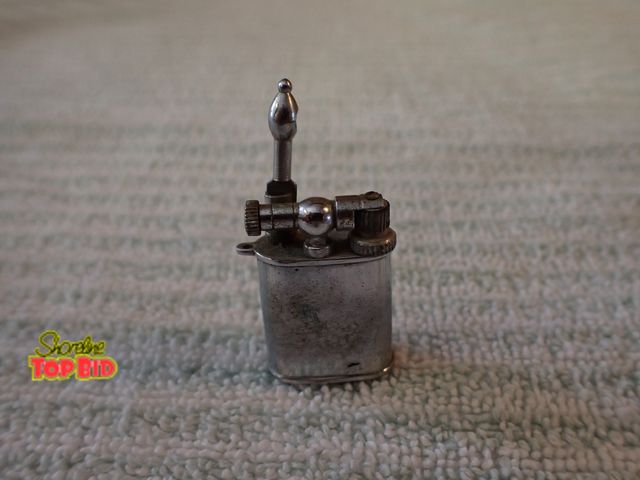 Lot 59-21407 - Mid-Century Miniature Lift-Arm Pocket Lighter, 1940s-50s Occupied Japan