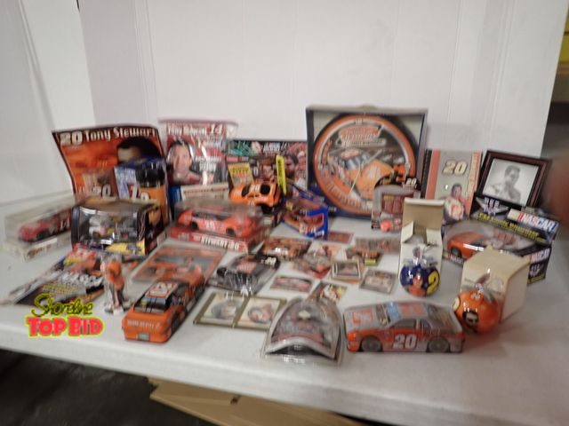 Lot 59-50022 - Large Tony Stewart #20 Nascar Collection Cups, Cars, Clock, Pictures