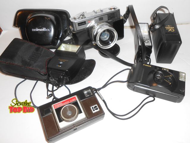 Lot 59-74231 - Lot Vintage 35mm Film Cameras plus Accessories.  Minolta HI-Matic, Canon, Kodak