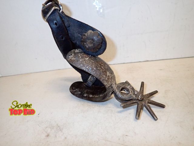 Lot 59-14666 - Ca. 1900 Cowboy Boot Spur Hand Forged Iron with Leather Belt &amp; Buckle, 8 Spurs, Est. Value $50.0...