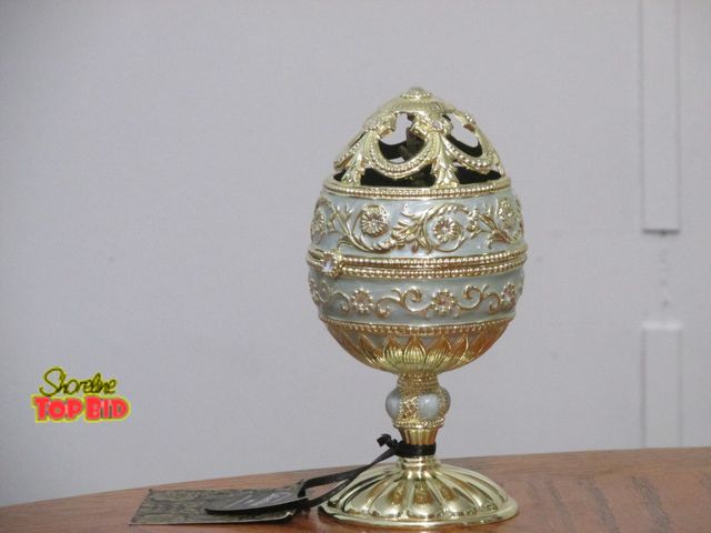 Lot 59-10131 - 7"T Christian Siriano 2019 Limited Edition collectible hand painted musical keepsake.  The egg opens...