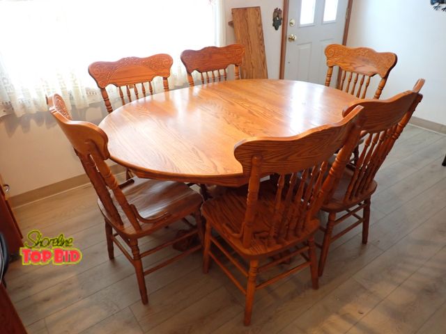 Lot 59-43544 - Solid Oak Oval Dining Table, Large Pedestal Base and 6 Chairs (1) Captain Chair, 2 Leafs - 12 inch e...