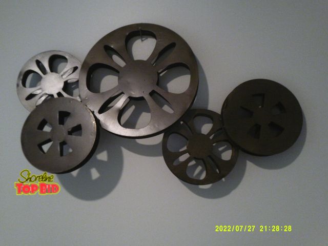 Lot 59-86031 - Two cool movie reel to reel metal wall art pieces