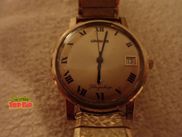 Lot 59-43328 - Vintage Gold-Tone Longines Flagship Watch with Roman Numerals and Date Display