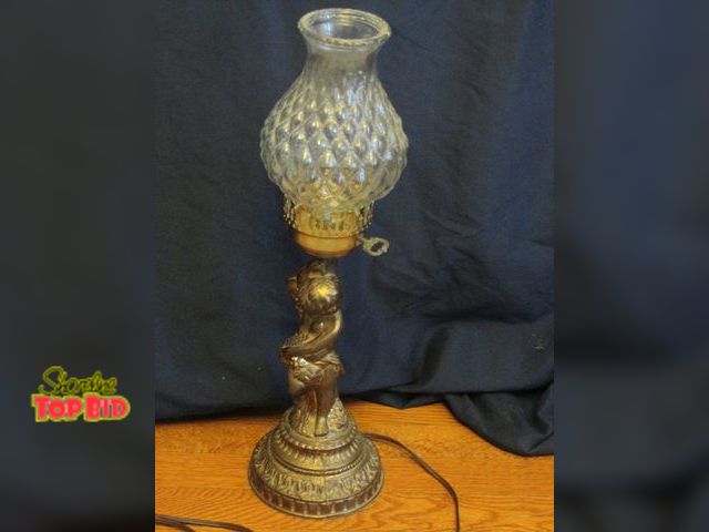 Lot 59-10045 - Old brass and clear glass lamp, tested and working