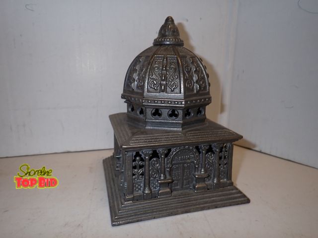 Lot 59-14235 - Antique Cast Iron "Columbia Bank" Still Coin Bank by Kenton Hardware Manufacturing Co. The bank was ...