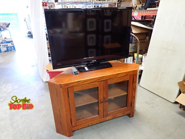 Lot 59-21048 - Solid Oak Mission-Style Corner TV Stand, Double Glass-Paneled Cabinet Doors, comes with Toshiba TV &...