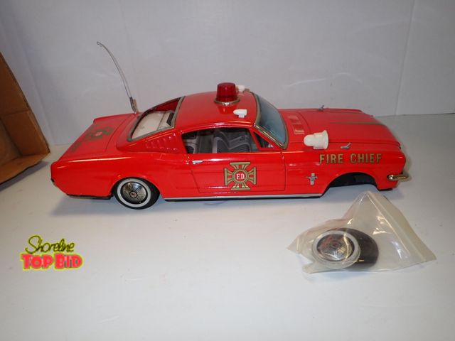 Lot 59-96012 - Tin 1960s Japan Ford Mustang Fire Chief Friction Car, 15 1/2" long, Missing Wheel