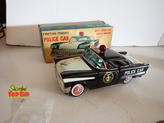 Lot 59-43138 - Friction Powered 1950s Tin Police Car, Mint Condition with Original Box