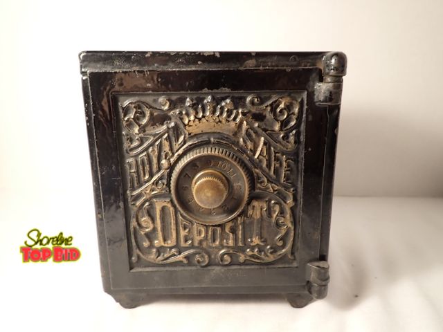 Lot 59-20044 - Antique Cast Iron "Royal Safe Deposit" Coin Bank, Gold Painted Embossed Facade with Central Combinat...