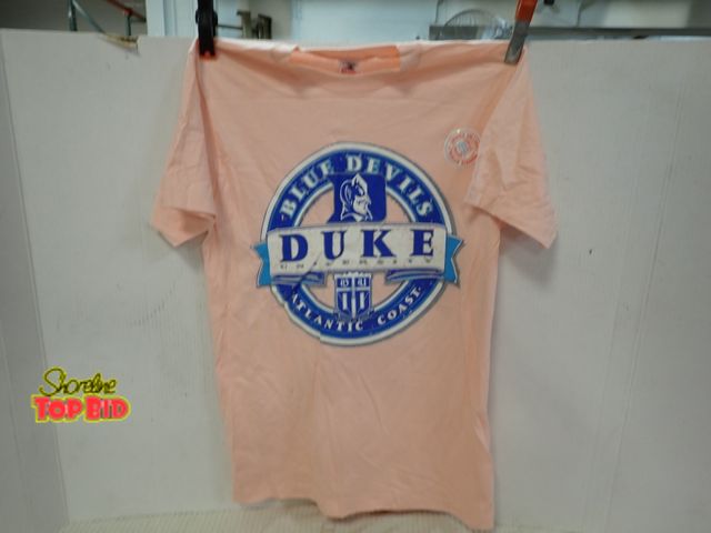 Lot 59-13148 - New Old Stock Vintage 1980s-1990s Peach Duke University Blue Devils T-Shirt features a Bold Blue Col...