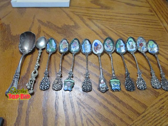 Lot 59-10090 - 10 collectible small painted spoons and 2 others.  The painted spoons are small in size, appear just...