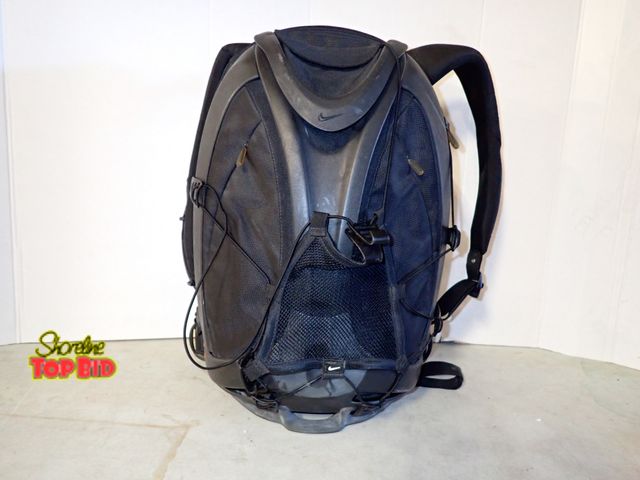 Lot 59-50094 - Black Nike Epic Hardshell Backpack features a distinctive molded exoskeloton design with mesh net on...
