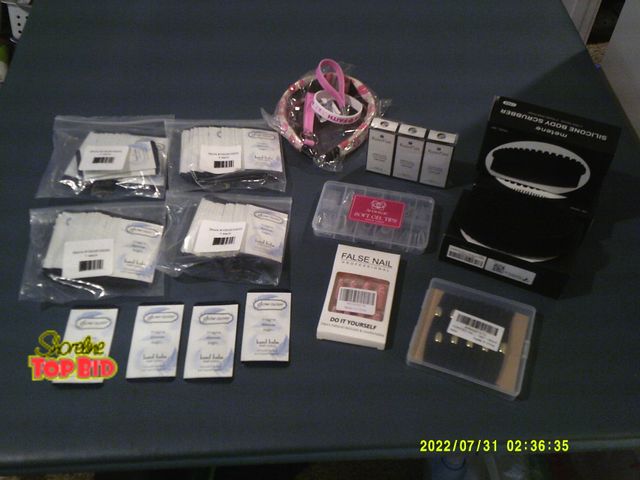Lot 59-86043 - Very nice collection of products. 3 amazing silicone body scrubbers, 2 packs false nails, nail polis...