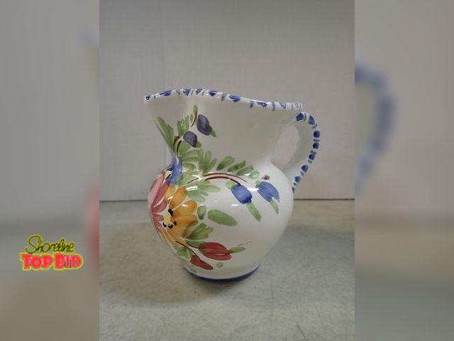 Lot 59-41782 - Station pitcher from 1986 as signed on the bottom much colored flowers in front edged in blue no iss...