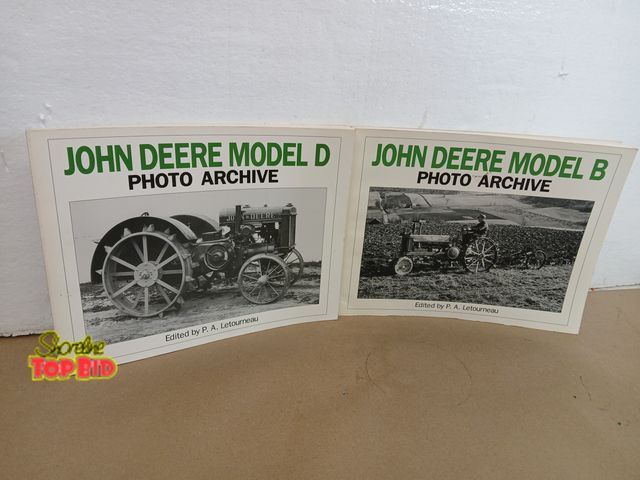 Lot 59-71017 - 2 John Deere  Tractors book both good condition