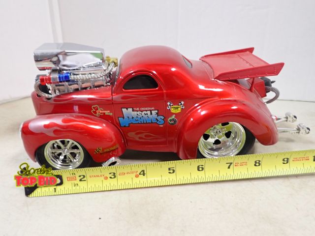 Lot 59-41234 - Muscle Machines Cast Wheely Car, 11" long, 1:18 Scale