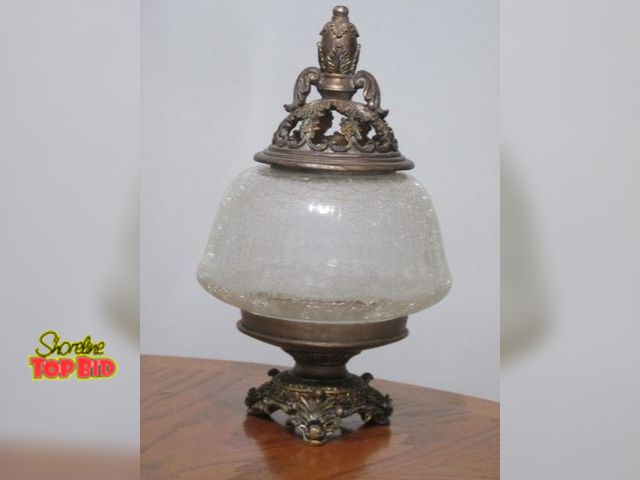 Lot 59-10121 - Ornate 15 1/2"T three footed rounded glass and composite material conversation piece?????  Has an or...