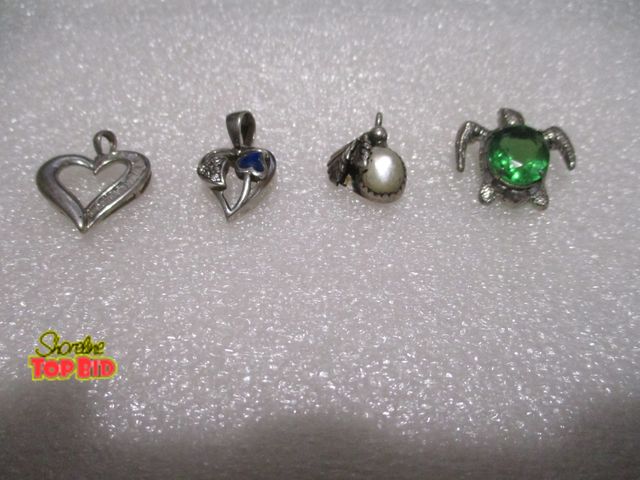 Lot 59-80015 - sterling  4 sterling silver charms 3 pendants and 1 broach