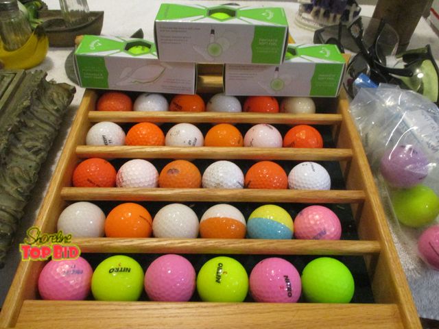 Lot 59-92023 - golf ball display + 3 boxes Callaway green balls + practice balls +