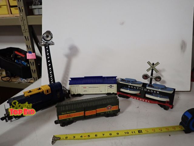 Lot 59-43307 - Various O Scale Train Car &amp; Engine with Spot Light &amp; Railroad Crossing Sign